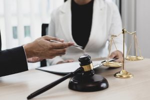 A lawyer talking to his client about business litigation in Milwaukee.