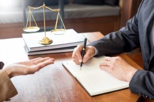 An attorney and his client talking about construction litigation in Milwaukee.